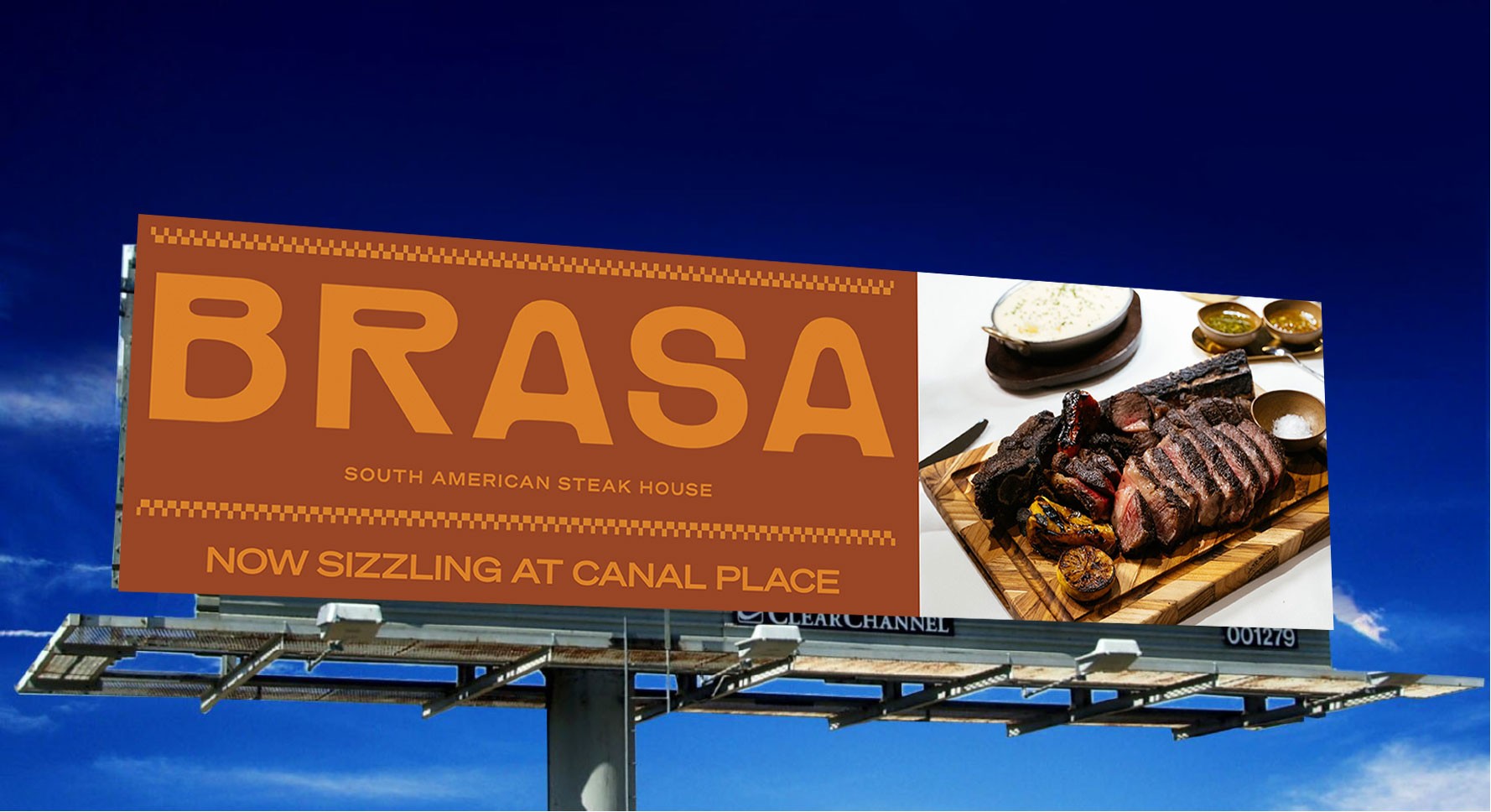 Brasa billboard mockup against a deep blue sky, combining its orange identity with steak photography and the message Now Sizzling at Canal Place