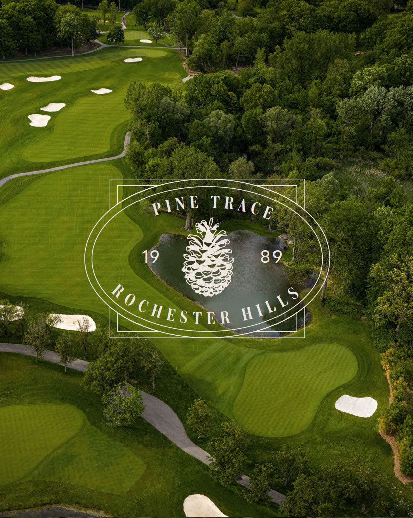 Pine Trace pinecone crest over an aerial view of the golf course, bunkers, and pond