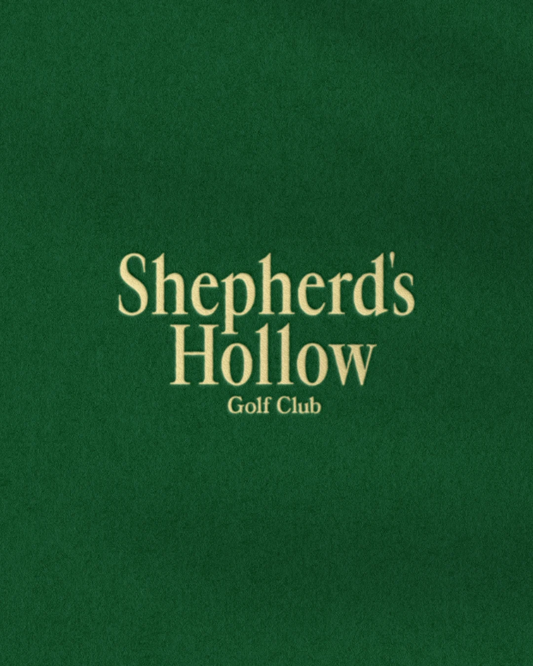 Shepherd’s Hollow Golf Club gold wordmark on a deep green background