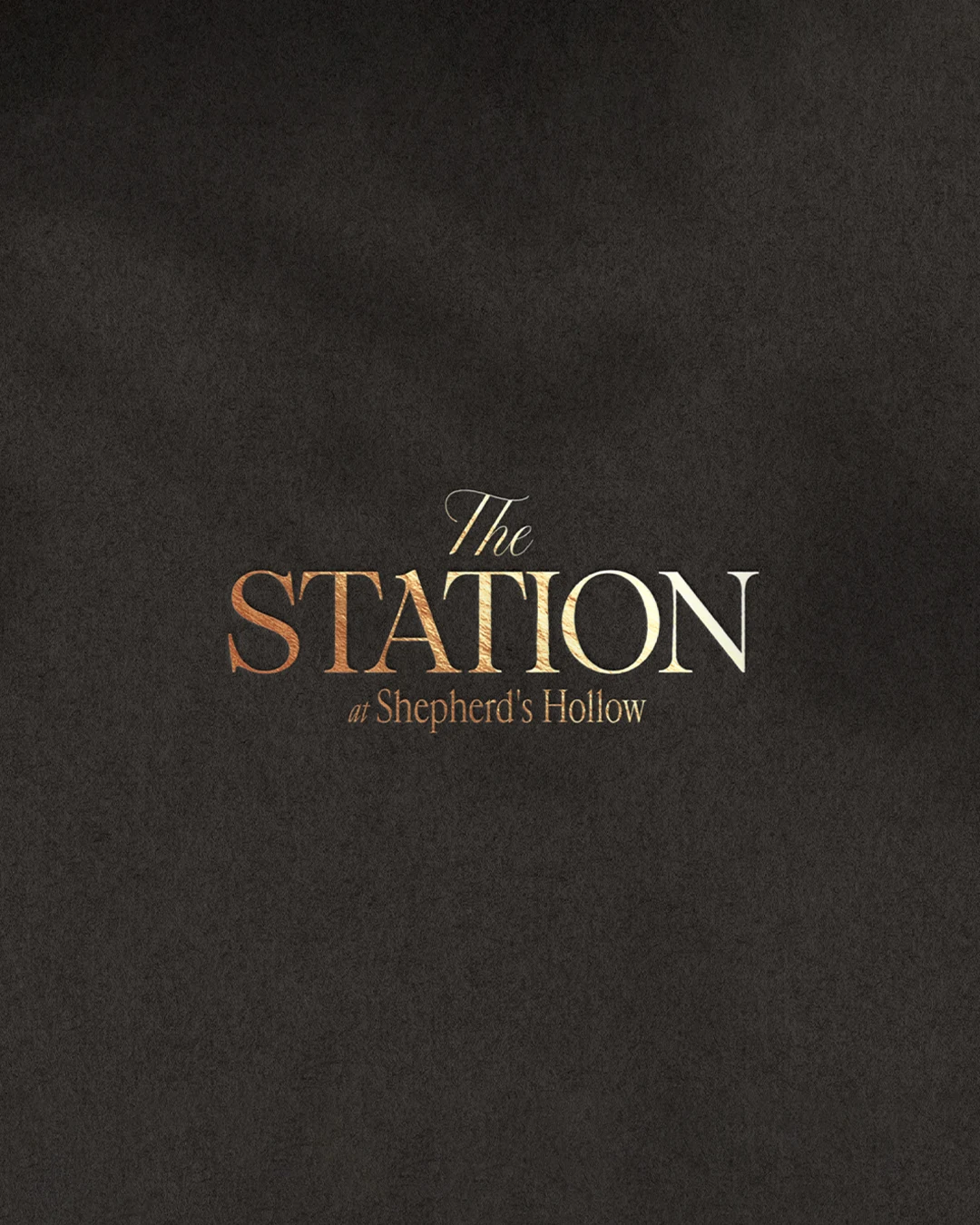 The Station at Shepherd’s Hollow gold wordmark on dark paper
