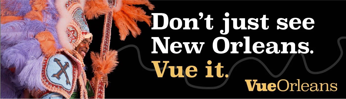Vue Orleans campaign banner featuring an elaborately feathered Mardi Gras costume