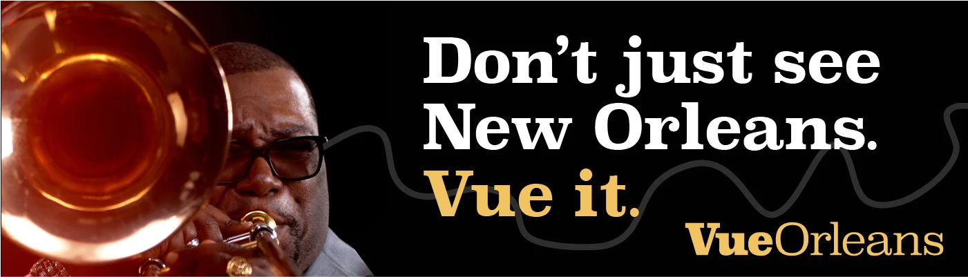 Vue Orleans campaign banner featuring a trombonist and the line Don’t just see New Orleans. Vue it.