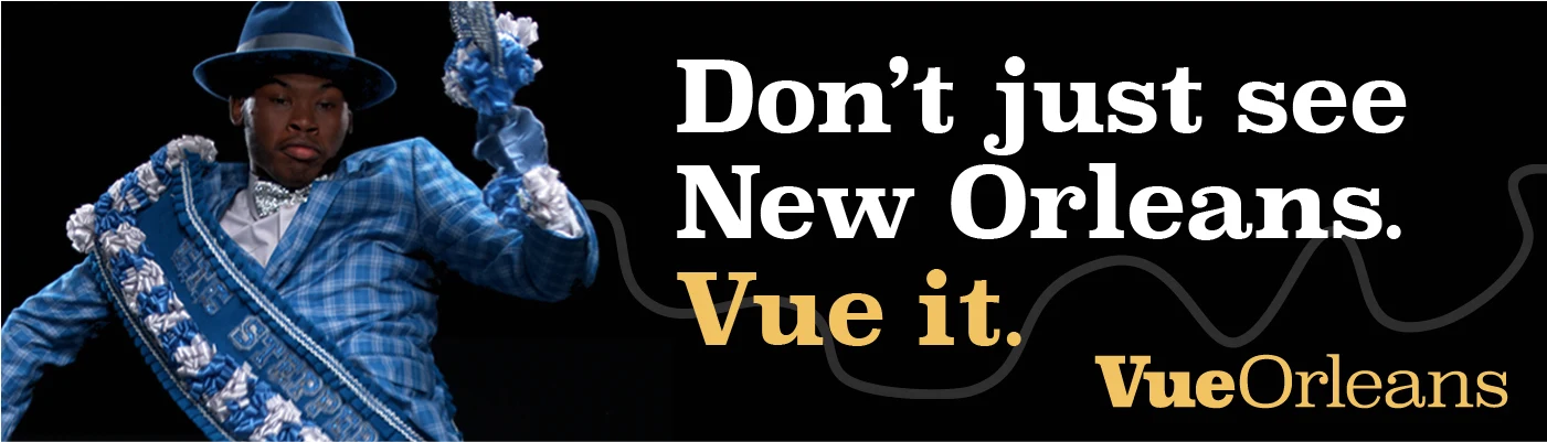 Vue Orleans campaign banner featuring a second-line performer in a blue suit